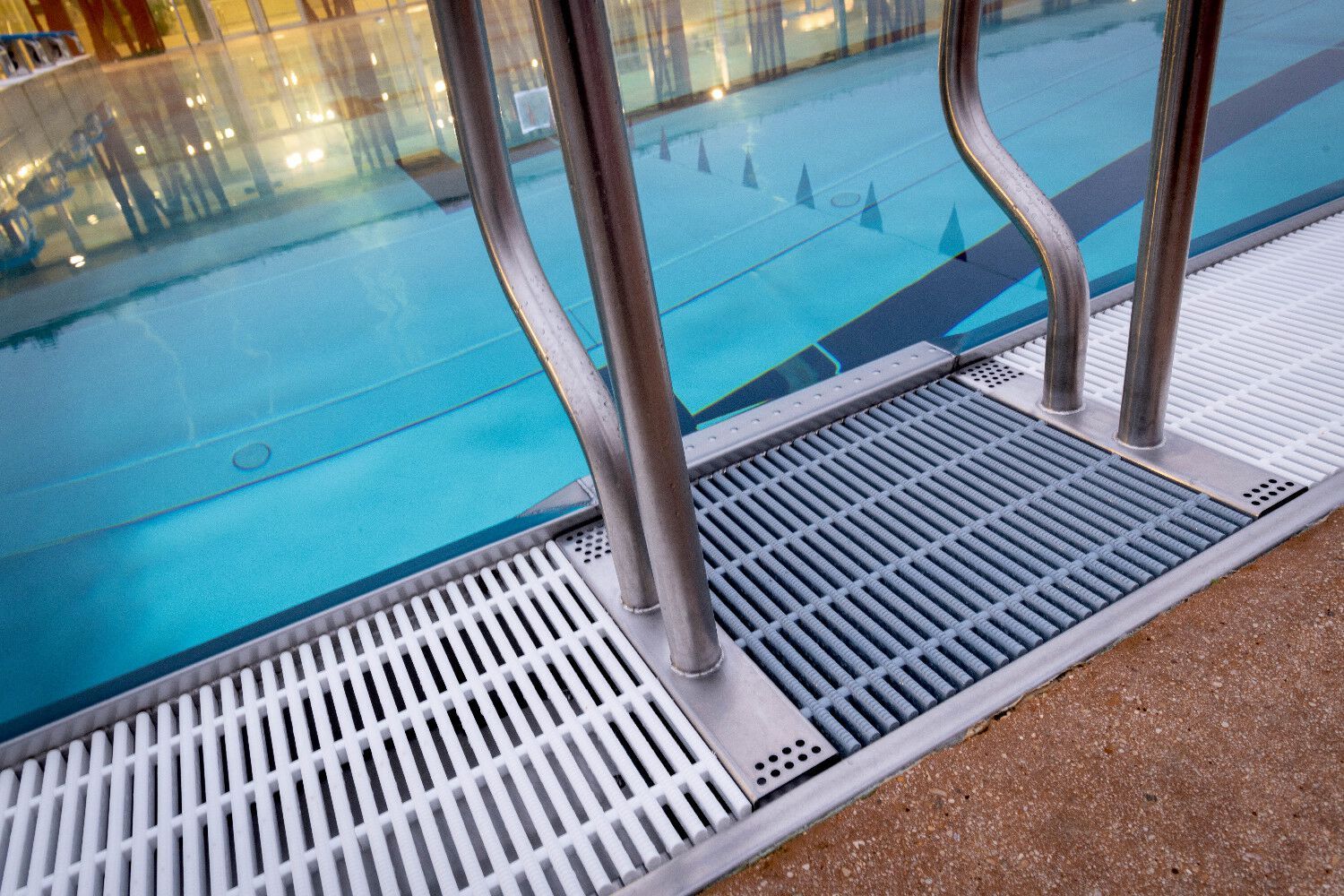 Swimming pool grate